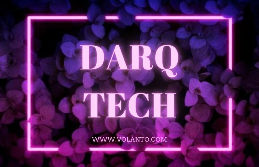 DARQ tech in pink neon with foliage background 